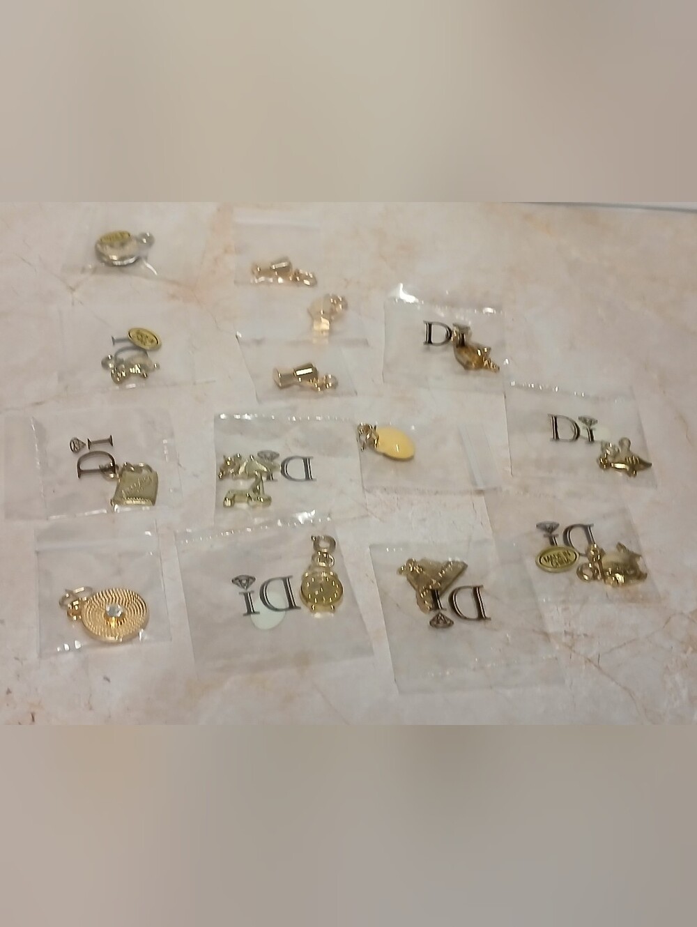 Gold-tone Jewelry Charms with 'D' Logo